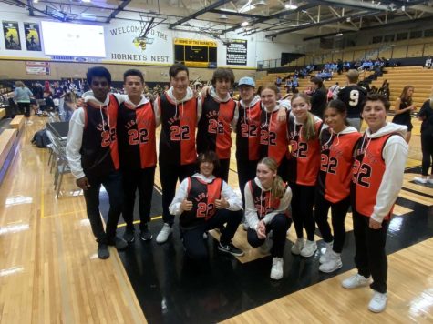 The DLD Future Legacies pose at their performance, taking place during a Hinsdale South pep rally.