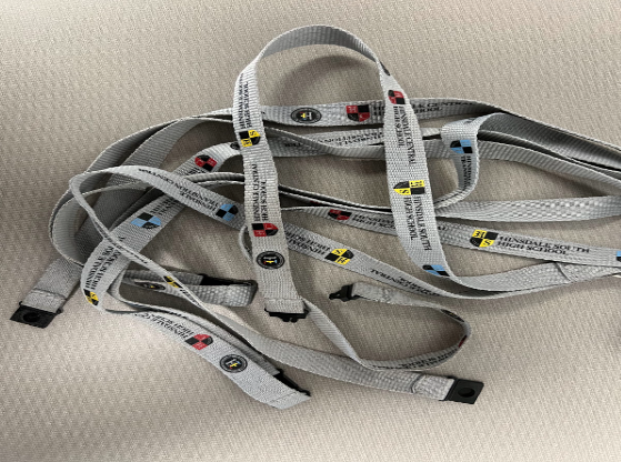 A Pile of Distinctive Gray Lanyards