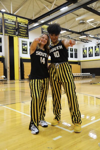 Seniors Amelia Lavorato (left) and Amerie Flowers (right) pose in the Hinsdale South gymnasium before their first game against Oswego East.