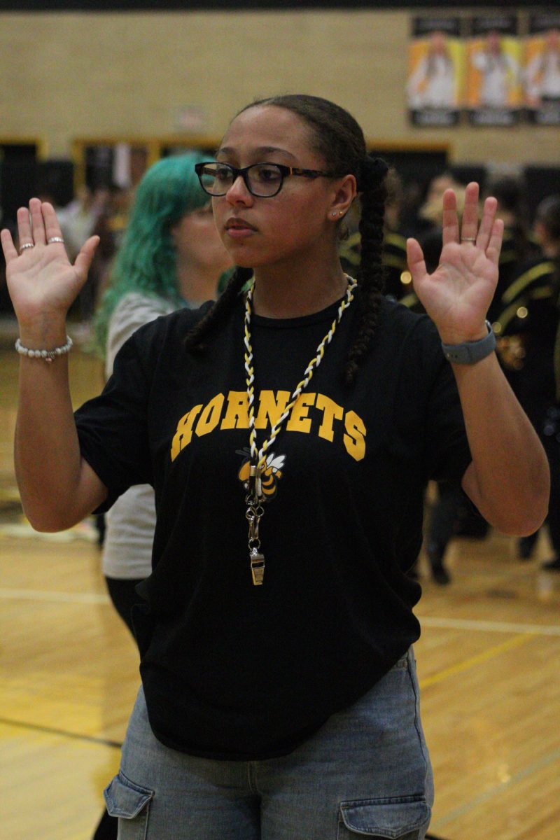 Andrea Crisp, leading the band as a drum major helping command the band what to do and what to play.