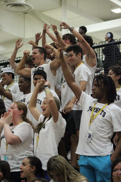 The sophomore crowd cheering, many doing so  that they can get a chance at getting a t-shirt from the cannon or catapult operated by the varsity football team.