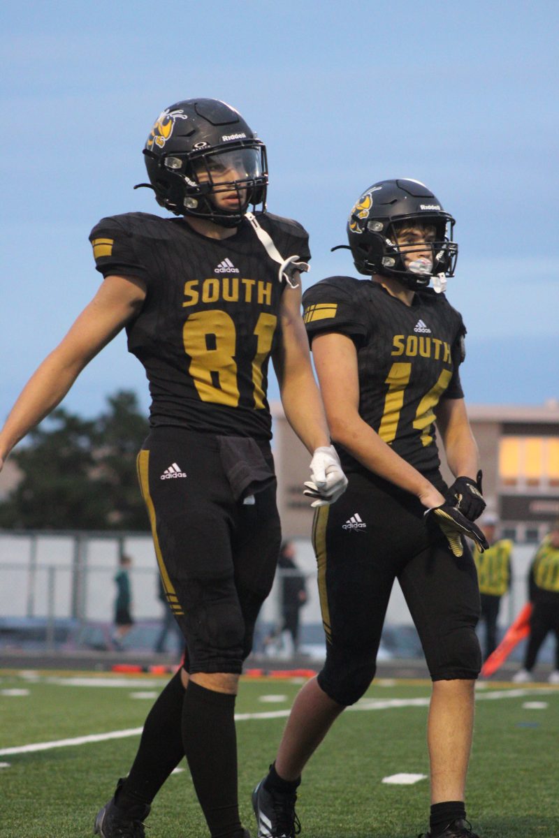 Jonathan Mansker, and Nick Miller returing to the offensive line after a play against the Willowbrook Warriors