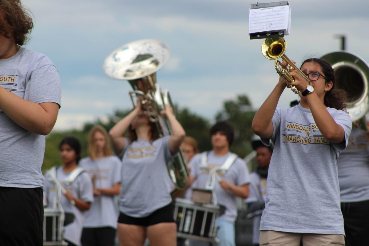 The marching band playing at the event, letting the atmosphere of the event to be more cheery and positive.