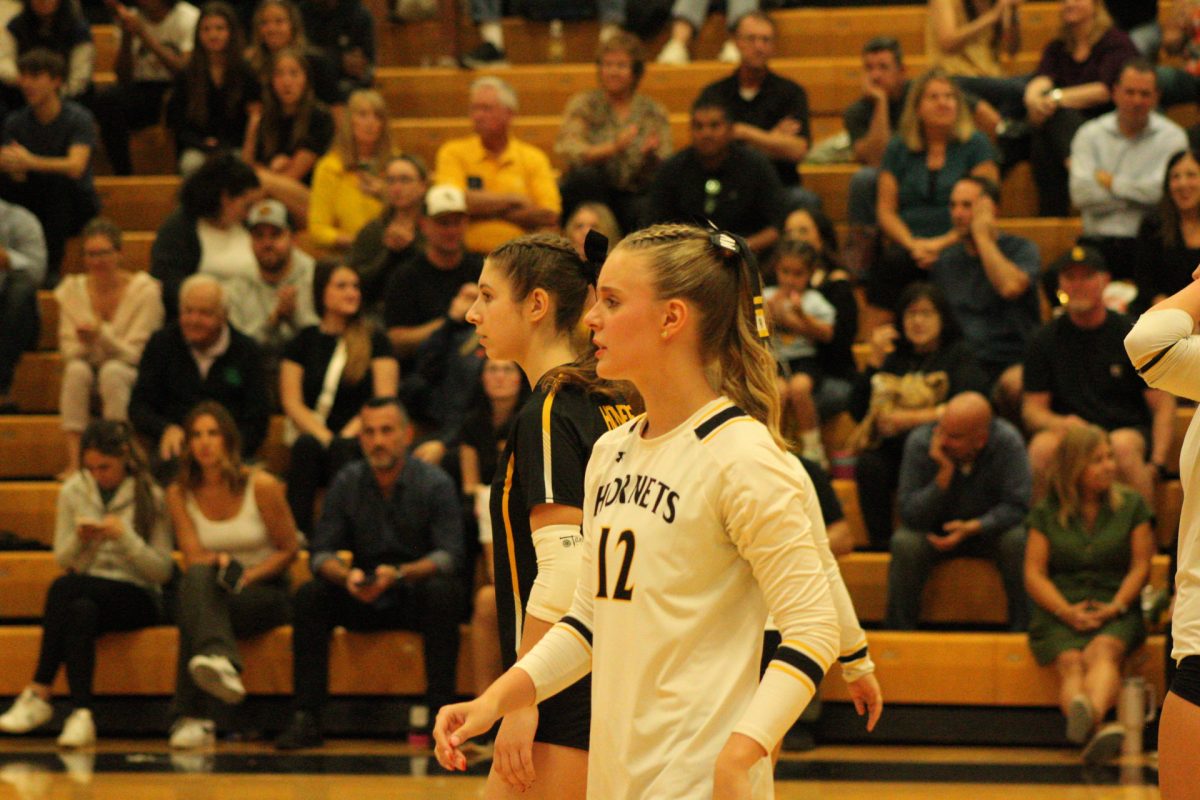 Maddy Ventimiglia along with her teammates waiting for a serve from the other team.