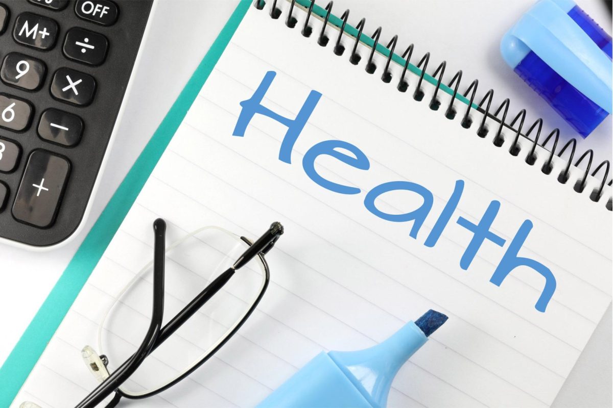 "Health" notebook with glasses and a marker. Image Courtesy of Pix4free