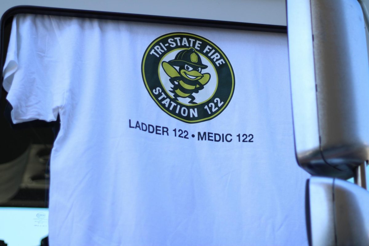 A picture of a t-shirt with the logo for the fire station hung on the firetruck, September 18th 2025