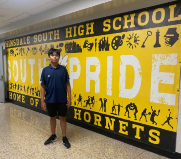 The author as an 8th grader standing in front of the South Pride Mural