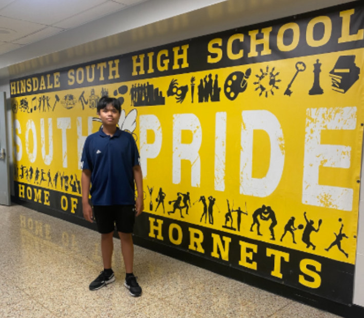 The author as an 8th grader standing in front of the South Pride Mural