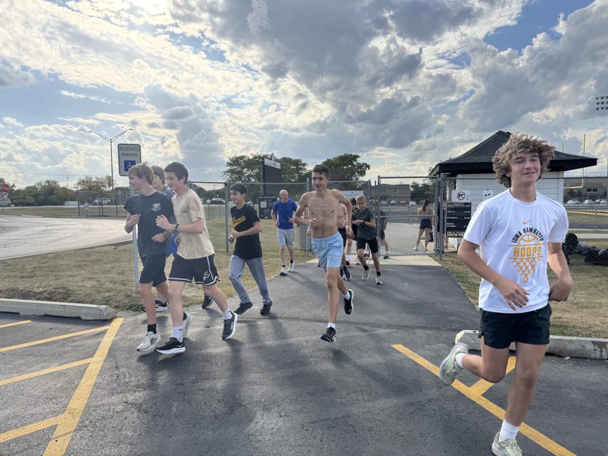 The cross country team starting their run.
