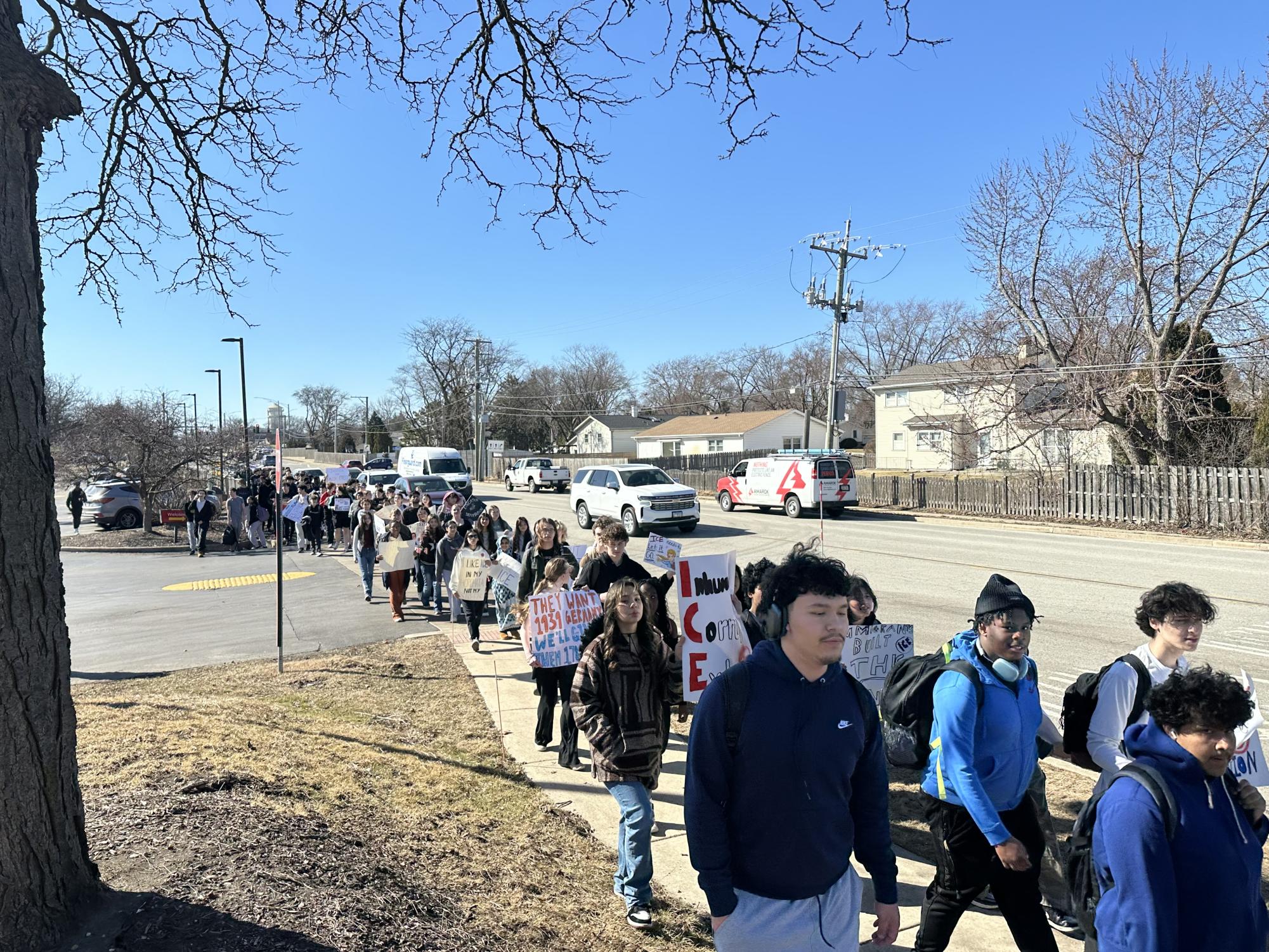 Students march from Mcdonalds to Willowbrook Town Center during the Walkout